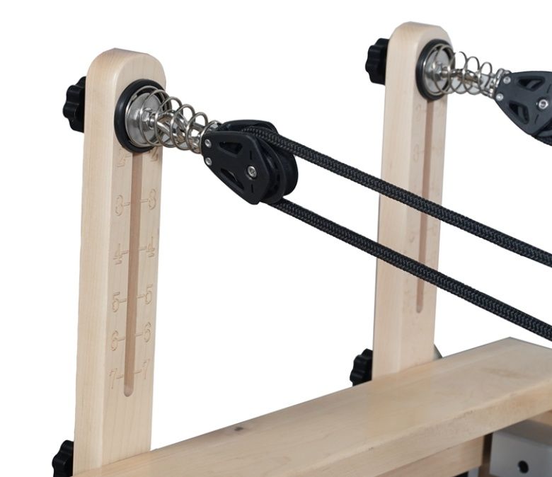 Máquina de ejercicio pilates plegable con patas de madera