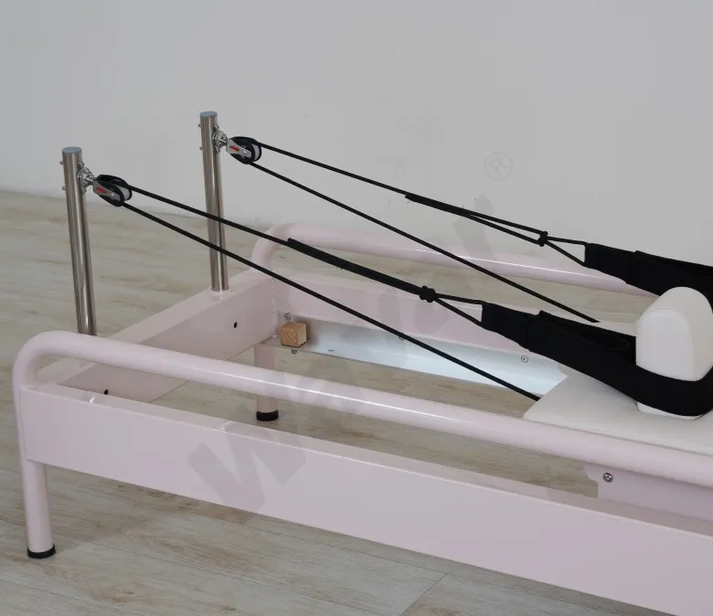 Nuevo reformador de pilates de acero rosa con barra de pie incorporada