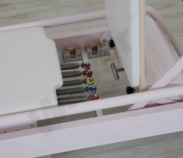 Nuevo reformador de pilates de acero rosa con barra de pie incorporada
