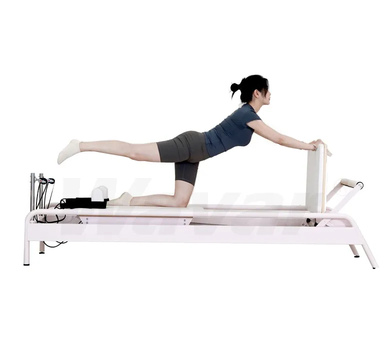 Nuevo reformador de pilates de acero rosa con barra de pie incorporada